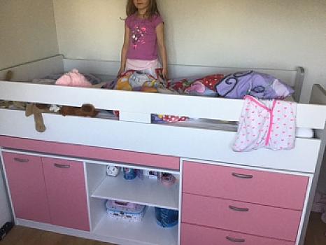 Loft bed with a retractable desk