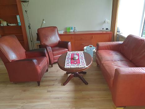 Free 2 leather chairs, leather sofa, and coffee table