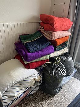 Stack of Blankets, Pillows, Duvet, Sleeping Bag and Bedding